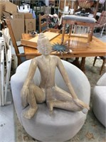 Wooden sitting statue