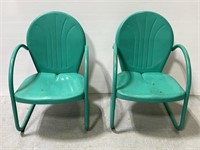 Pair of vintage teal metal shell back patio chairs