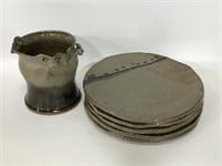 Collection of handmade ceramic plates and vase