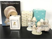 Collection of Precious Moments figurines and book