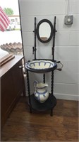 Old wash stand with basin and pitcher as well as