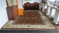 Large rug in nice condition . Colors are brown,