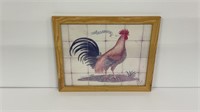 Rooster print in wood frame. Measures 22.5x18.5.