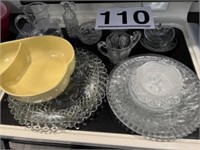 Assortment of glass serving dishes and plates and