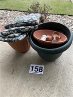 Several planters and chair cushions