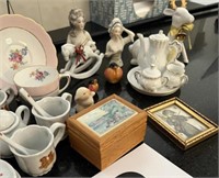 Assortment of minature tea sets and decor