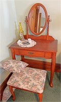 Vanity stool and pillows contents on top not