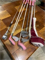 Pink golf clubs.  8 pieces