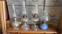 4 antique oil lamps