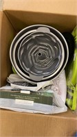 Large box of kitchen gadgets and cookware