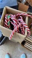 Box of plastic candy canes for decoration