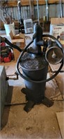 vintage oil pump and resevoir tank