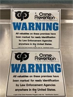 Pair of crime prevention warning signs new