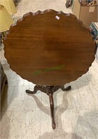 Small mahogany tilt top table with a piecrust