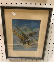 Small framed print of three biplanes/dogfight.