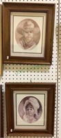 Two framed prints of a little boy in a cowboy hat