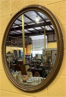 Large oval wall mirror w/chips in the frame -