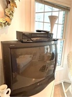 TV, VHS & White Floor Lamp