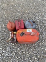3 plastic 1-2 gallon gas cans/ 2 metal gas cans