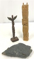 Two Totem Poles and a Piece of Coal or Flint