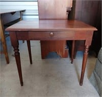 Wooden table with drawer