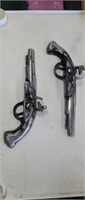 Two vintage cast aluminum black powder pistols