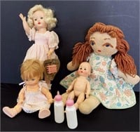 Vintage dolls including a handmade stuffed doll an