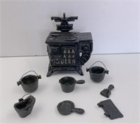 Miniature "Queen" cast iron stove set with assorte