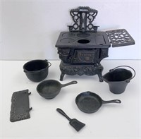 Miniature "Crescent" cast iron stove set with asso