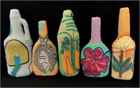 Ornately decorated bottles featuring floral patter