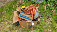 Box of extension cords and lights