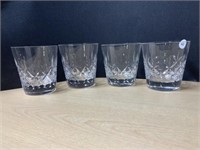 4 drinking glasses marked on bottom with crown