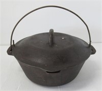 Cast iron Made in USA bean pot with lid.
