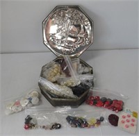 Metal tin filled with buttons.