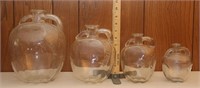 4 graduated size apple shape jugs/bottles