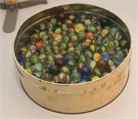 Hundred's of glass Cat's Eye marbles in can