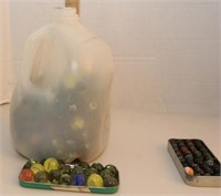 2/3 gallon of glass marbles- see sample in tin lid