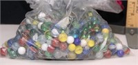 100's of glass marbles in bag- mostly cat's eye