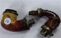 Two  unusual pipe heads