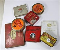 Seven tobacco tins