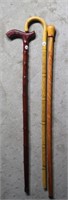 3 Wooden walking sticks with carvings