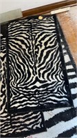 Large zebra print rug
W 2 small rugs
Set of 3