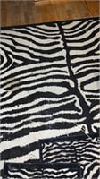 Large zebra print rug
W 2 small rugs
Set of 3