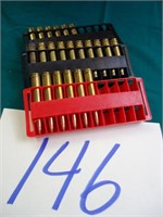 6 LIVE ROUNDS AND MISC BRASS 7MM