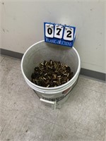 BUCKET OF 40 CAL USED BRASS