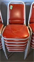 red stacking chairs x6