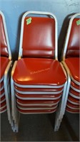 Red stacking chairs x6