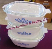 3 pieces of blue corning ware with lids