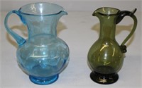 two hand blown glass pitchers