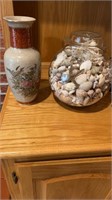 Flower vase and jar of shells